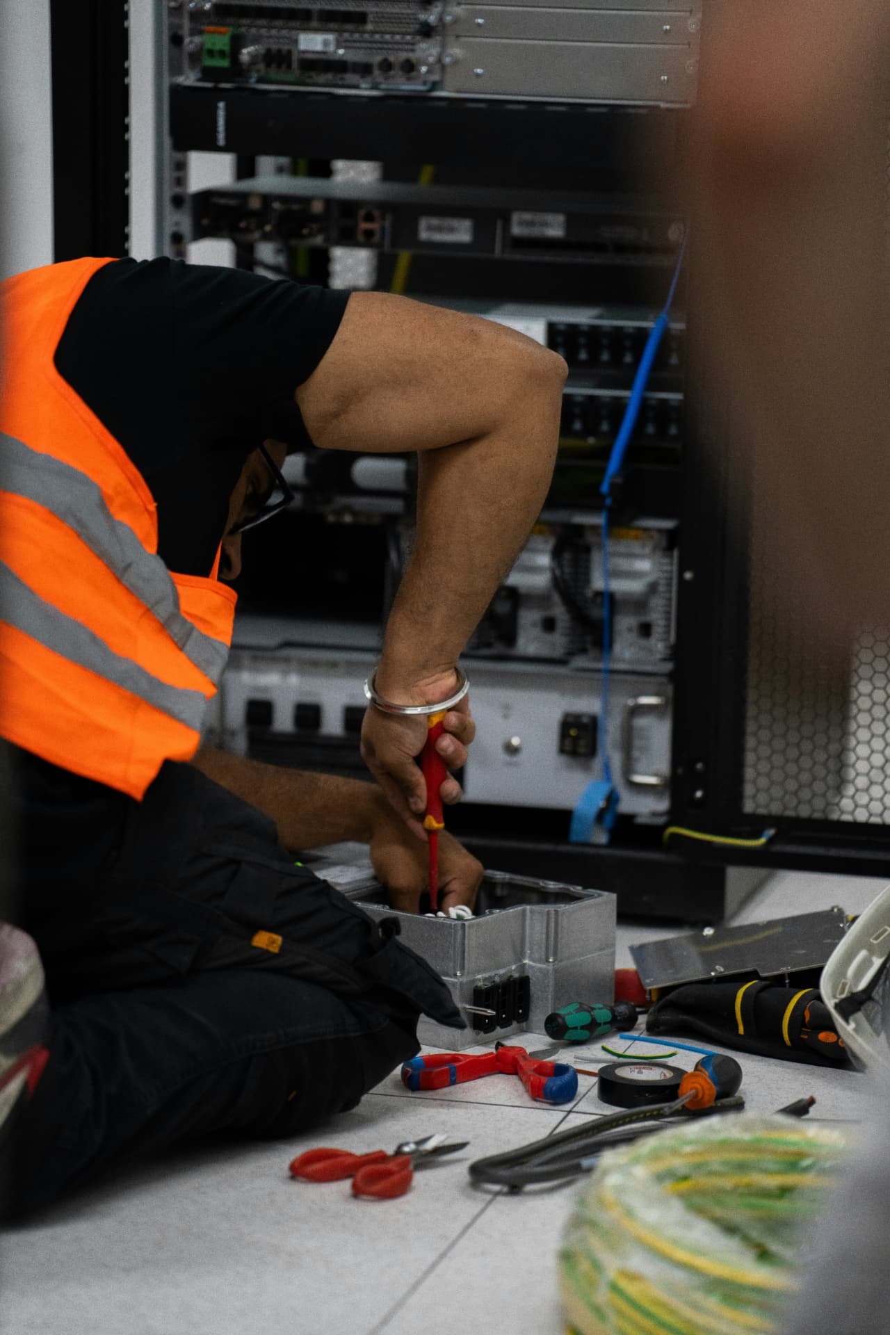 On-site technician servicing business server and network equipment