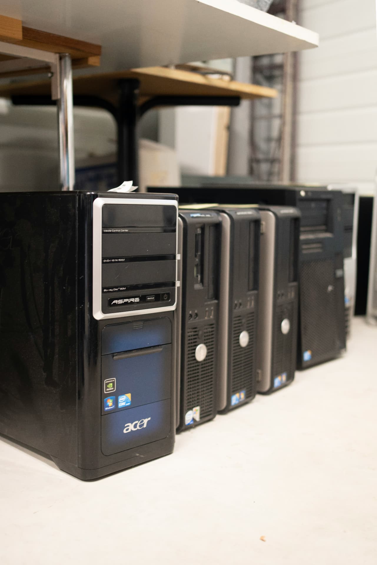 Desktop computers lined up for inspection and service